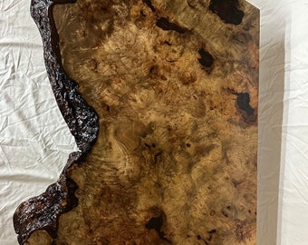 43 1/2” long x 26 1/2” wide, 1 5/8”. Myrtle wood burl live edge coffee table