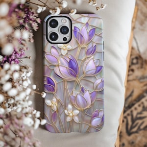 May include: A phone case with a stained glass design featuring purple and white flowers on a pearlescent background.