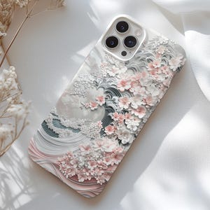 May include: A set of three ceramic vases in varying heights and shapes. The vases are glazed in a matte white finish, offering a minimalist aesthetic. The tallest vase is approximately 10 inches high.