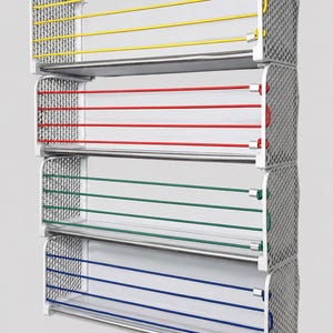 May include: A four-tier shelving unit featuring light gray side panels with a perforated grid pattern. Each shelf includes a flat base and three horizontal tension cords in yellow, red, green, and blue, secured by metallic fasteners at the ends.