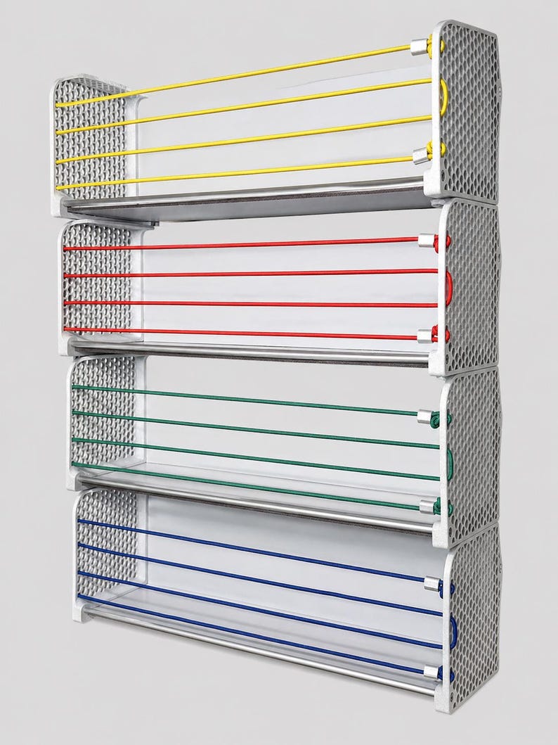 May include: A four-tier shelving unit featuring light gray side panels with a perforated grid pattern. Each shelf includes a flat base and three horizontal tension cords in yellow, red, green, and blue, secured by metallic fasteners at the ends.