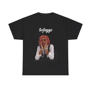 May include: Black t-shirt with a white graphic of a man with pink hair. The graphic says "Sofaygo" in white text.