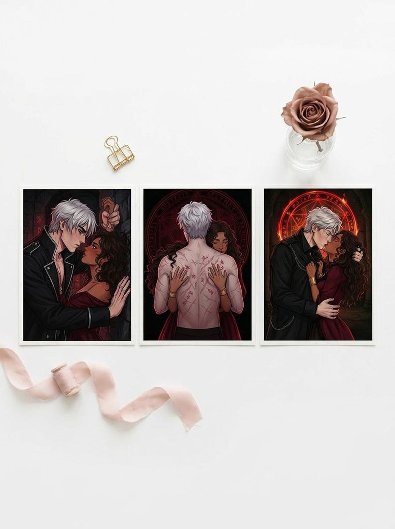 May include: Three art prints with romantic illustrations. Each print shows a couple in a passionate embrace, with one showing a man's back covered in markings. The colour palette includes deep reds, blacks, and whites, creating a dramatic and intimate feel.