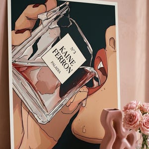 May include: Art print featuring a stylized illustration of a person drinking from a perfume bottle. The bottle has a label that reads "KAINE FERRON" and "PALADIA". The artwork is set against a dark background.