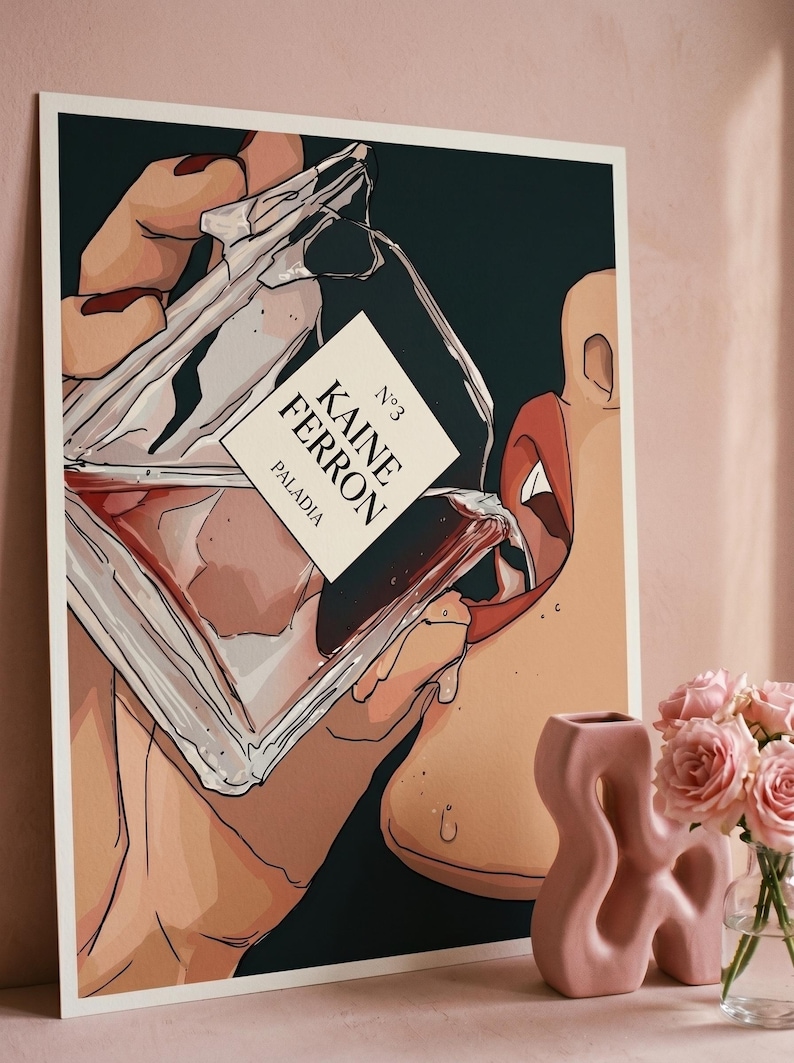 May include: Art print featuring a stylized illustration of a person drinking from a perfume bottle. The bottle has a label that reads "KAINE FERRON" and "PALADIA". The artwork is set against a dark background.