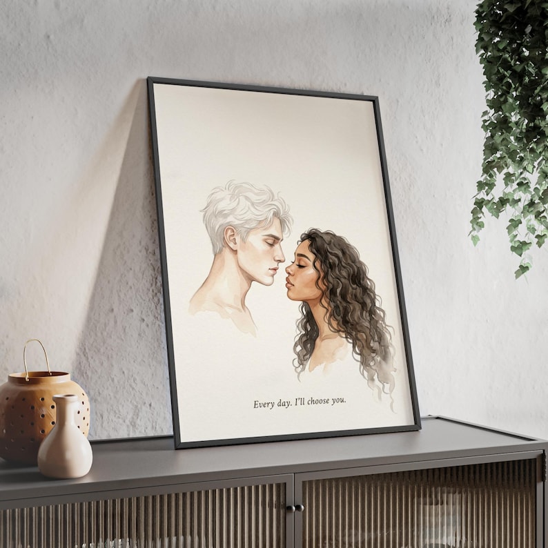 May include: A framed art print featuring a watercolor illustration of a couple in a tender moment. The artwork depicts a man with white hair and a woman with dark, curly hair, their faces close. The text "Every day. I'll choose you." is at the bottom.