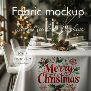 May include: White tablecloth with a red and green "Merry Christmas" design. The tablecloth is set for a holiday dinner with candles, plates, and silverware.
