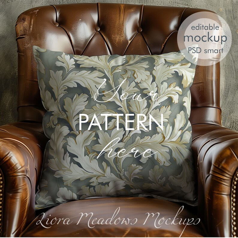 May include: A brown leather armchair with a decorative pillow featuring a gold and gray floral pattern. The pillow has the text "Your Pattern Here" on it. The image is a mockup for a pillow design.