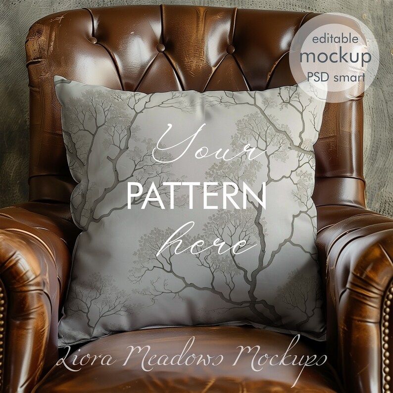 May include: A gray throw pillow with a tree branch pattern on a brown leather armchair. The pillow has the text "Your Pattern Here" on it.