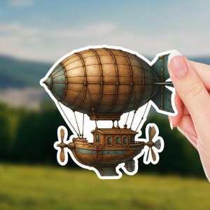 May include: A sticker featuring a detailed illustration of a steampunk airship. The airship has a brown and blue color scheme, with a large, rounded body and a detailed cabin. It includes propellers and a tail fin, suggesting flight.