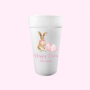 May include: White foam cup with a pink bunny and eggs design. The text "Happy Easter The Smiths" is printed on the cup.