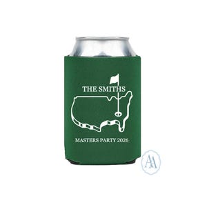 May include: Green can cooler with a white outline of the United States and a golf flag design. The text "THE SMITHS" and "MASTERS PARTY 2026" are printed in white. The can cooler is designed to keep beverages cold.