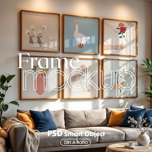 May include: A living room interior with a grey sofa and a variety of framed artwork on the wall. The artwork includes a goose, flowers, and abstract designs. The sofa has cushions in shades of blue, yellow, and brown. The room is decorated with plants and a wooden coffee table.