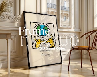 May include: A black framed poster with a colorful illustration of two figures holding a globe. The poster has the text "Untitled (Earth Day)" and "K. Haring" printed on it.