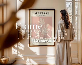 May include: A framed print of an abstract art piece by Matisse, titled "The Cut-Outs". The print is in a brown frame and is hanging on a white wall. The text on the print reads "MATISSE the CUT-OUTS De Vendredi 27 Février au Samedi 28 Mars 1953".