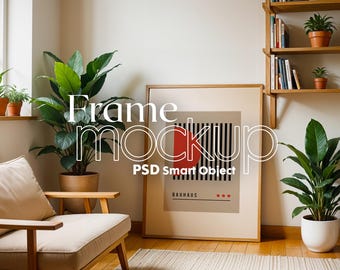 Pode incluir: Um pôster emoldurado com um design geométrico vermelho e preto. O pôster está pendurado em uma parede de uma sala de estar com uma cadeira e plantas. O texto no pôster diz "Bauhaus".