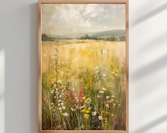 May include: A painting of a field of wildflowers in shades of yellow, green, pink, blue, and white. The field is in the foreground, with a distant landscape in the background. The painting is framed in a light wood frame.