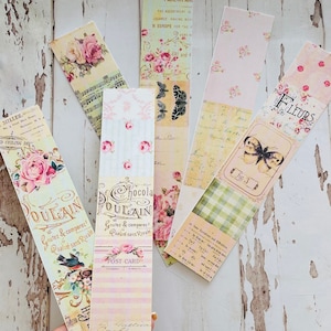 Puede incluir: Un conjunto de seis marcap&aacute;ginas de estilo vintage con dise&ntilde;os florales, texto escrito a mano y una mariposa. Los marcap&aacute;ginas est&aacute;n impresos en papel con un acabado texturizado y tienen un aspecto desgastado. Los marcap&aacute;ginas son perfectos para a&ntilde;adir un toque de encanto vintage a tus libros.