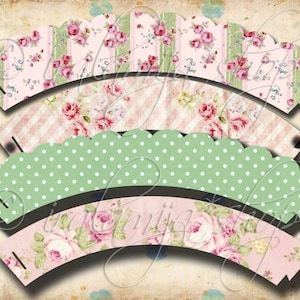 Op de afbeelding: Drie cupcake-verpakkingen met een vintage bloemenontwerp. De verpakkingen zijn roze, groen en wit met een gegolfde rand. De verpakkingen zijn perfect om een ​​toets van elegantie aan je cupcakes toe te voegen.