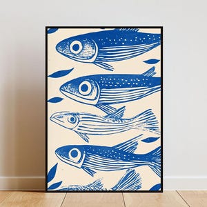 May include: A framed print of a blue and white illustration of four fish swimming in a row. The fish are stylized and have a simple design. The background is a light cream color.