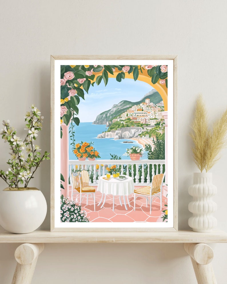 May include: A colorful illustration of a patio scene with a table and chairs set for a meal. The patio is decorated with flowers and overlooks a view of a coastal town and ocean.