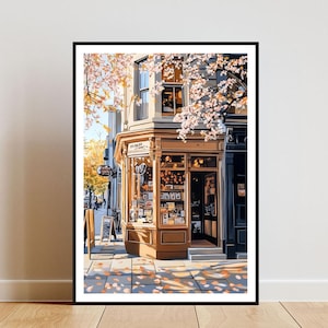 May include: A storefront with a yellow facade and large windows. The shop is decorated with flowers and has a sign that reads "The Book Nook". The storefront is located on a street with trees and a sidewalk.