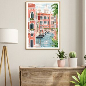 May include: A watercolor illustration of a canal in Venice, Italy. The canal is lined with pink buildings and a bridge. There are boats in the water and green trees in the foreground.