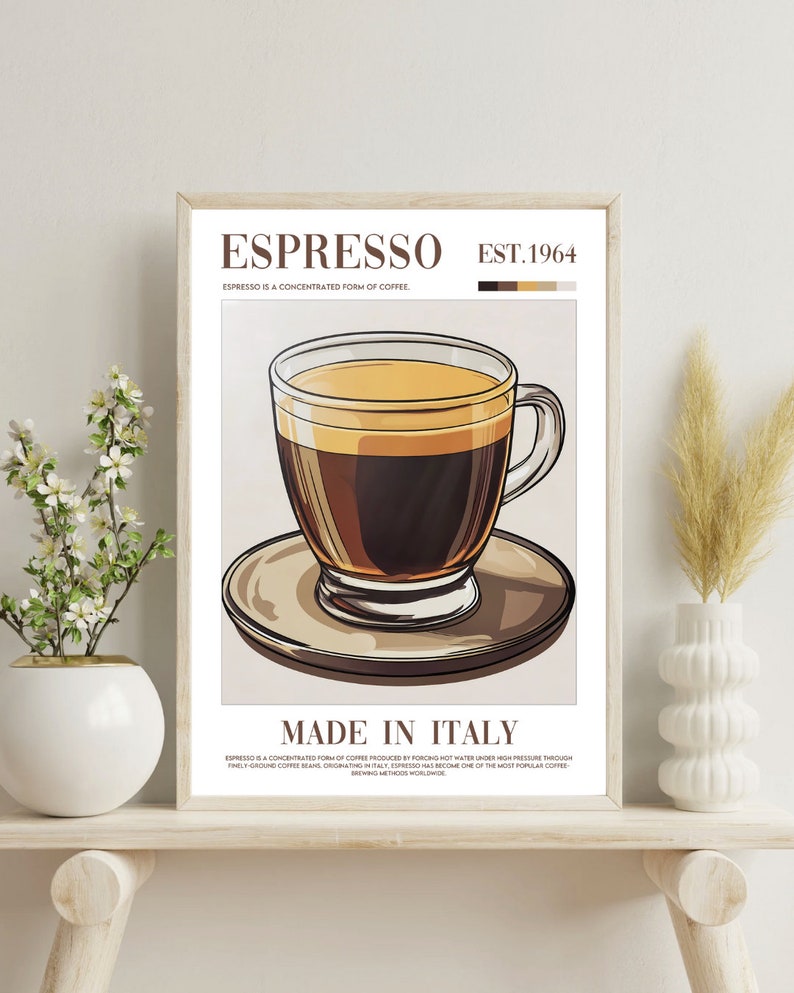 May include: A vintage-style poster with a brown wooden frame, featuring a graphic illustration of a glass of espresso coffee on a saucer. The poster has the text "Espresso Est. 1964" and "Made in Italy" in a brown font.