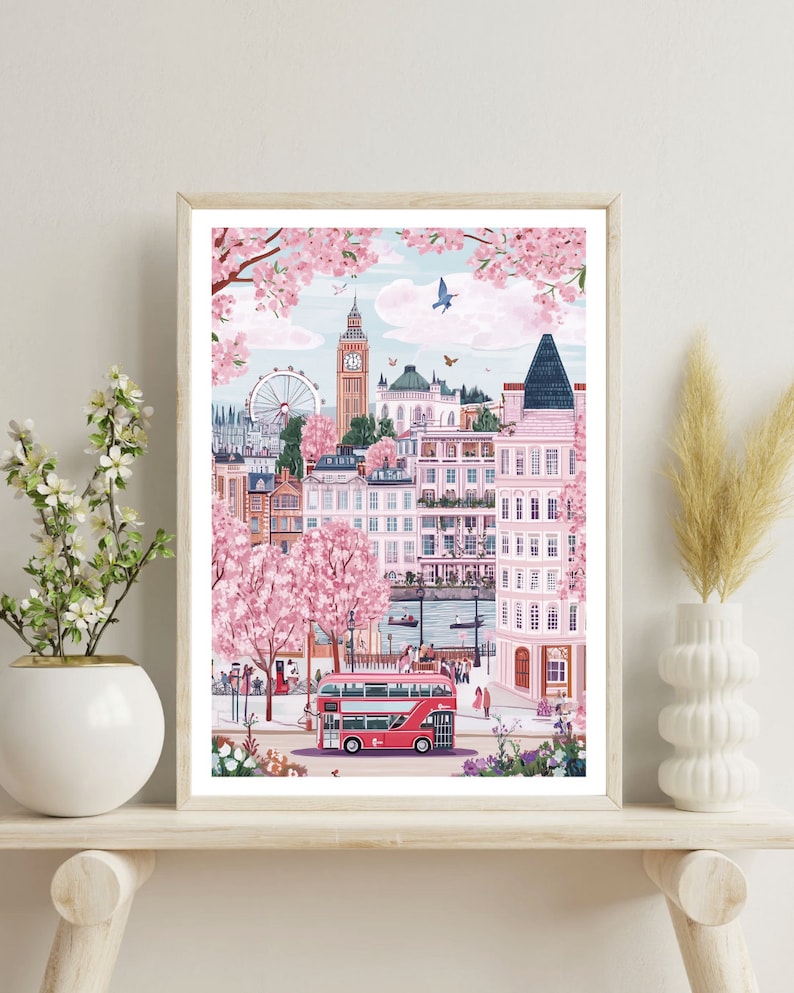May include: A colorful illustration of London, England, with Big Ben, the London Eye, and a red double-decker bus. The scene is set in spring with cherry blossoms in bloom.