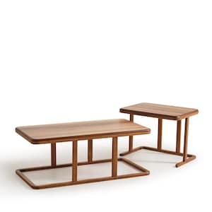 May include: Two wooden tables with a warm brown finish. The larger table has a rectangular top and a unique base design. The smaller table has a similar design, with a rectangular top and four legs. Both tables are set against a white background.