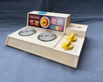 Vintage Fisher-Price Mini Stove #919 – 1973 play kitchen toy with timer bell and knobs