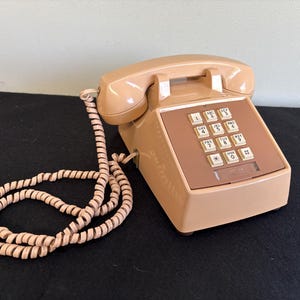 Push button phone - creamy tan with white buttons