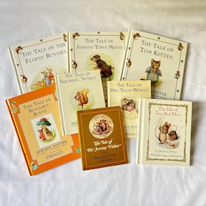 May include: A collection of eight Beatrix Potter books including The Tale of the Flopsy Bunnies, Johnny Town-Mouse, Tom Kitten, Benjamin Bunny, Squirrel Nutkin, Mrs. Tiggy-Winkle, Mr. Jeremy Fisher, and Two Bad Mice, featuring various animal illustrations.
