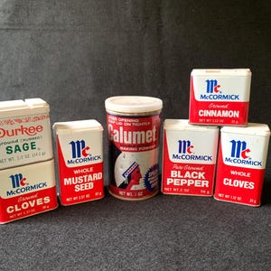 Vintage spice tin and baking powder set – McCormick, Durkee, and Calumet kitchen containers with retro graphics