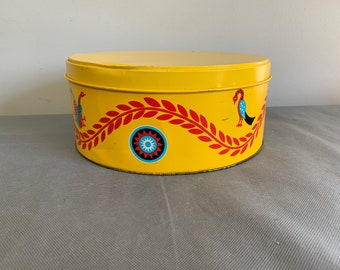 Vintage pretzel tin in bright yellow with folky Pennsylvania Dutch designs