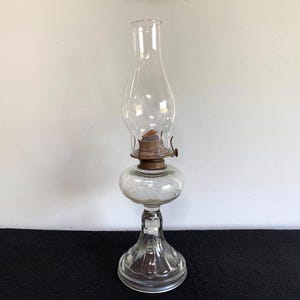 Vintage clear glass oil lamp – early 20th century pedestal base kerosene lamp with Eagle burner