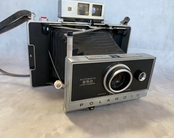 Polaroid 250 Land Camera - with instruction manual and leather strap