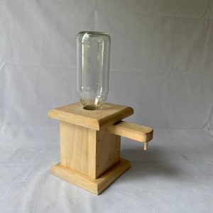 Vintage dispenser - wood base with a glass jar top - 1980s - for nuts or candy