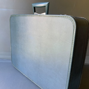 Medium blue suitcase by Monarch - silver hardware - with original key
