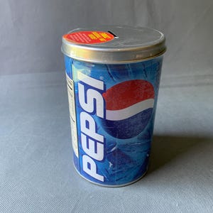 Vintage sealed Pepsi metal bank with surprise baseball hat inside - Toys “R” Us MLB collectible tin