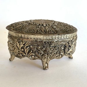 Ornate footed trinket box - lined with red velvet