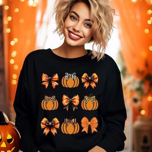 Cozy Pumpkin Bow Sweater, Halloween Pumpkins, Fall Colors (Women’s S-XL)