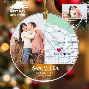 May include: A clear, round Christmas ornament featuring a couple's photo and a map of Los Angeles. The ornament includes the names "Sean & Elia" and the wedding date "02.22.2025". A small photo is in the upper right corner.