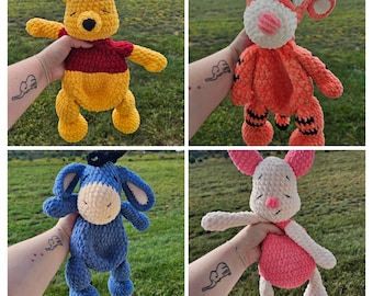 May include: Four crocheted plush toys: a yellow bear with a red shirt, an orange tiger with black stripes, a blue donkey, and a pink pig. Each toy is held up against a green background.