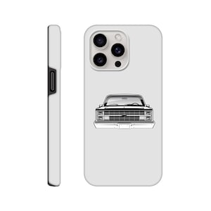 May include: A white phone case featuring a black and white line drawing of a classic pickup truck's front. The case has a smooth finish and a side view showing the volume and power buttons.