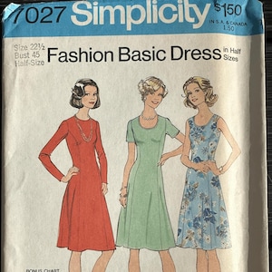 May include: Vintage Simplicity sewing pattern 7027 for a Fashion Basic Dress. The pattern features illustrations of three different dress styles in red, green, and blue floral print. Includes a bonus chart for a princess dress.