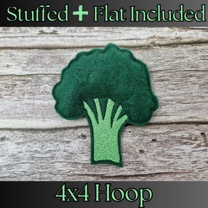 May include: Green felt broccoli applique for embroidery. The design includes both a stuffed and flat version. The image shows the applique on a wood background with the text "Stuffed + Flat Included" and "4x4 Hoop".