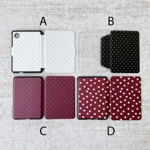 May include: Four rectangular e-reader cases labeled A, B, C, and D. Case A is white with small black dots. Case B is black with small white dots. Case C is dark maroon with small white dots. Case D is dark maroon with larger light pink dots.