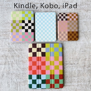 May include: Four rectangular tablet and e-reader cases with checkered patterns. The top left case features lime, black, and pink squares. The top middle is light blue and white. The top right is brown and pink. The bottom case has multicolored squares.