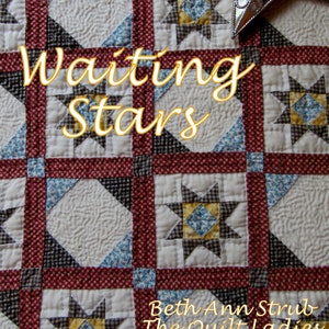 May include: A quilt with a patchwork design featuring a repeating pattern of stars. The quilt is made with red, white, and blue fabrics. The title "Waiting Stars" is written in a decorative font across the center of the quilt. The text "Beth Ann Strub The Quilt Ladies" is written in a decorative font at the bottom of the quilt.